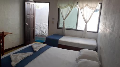 Bahia de la Academia House | Hostal Darwin