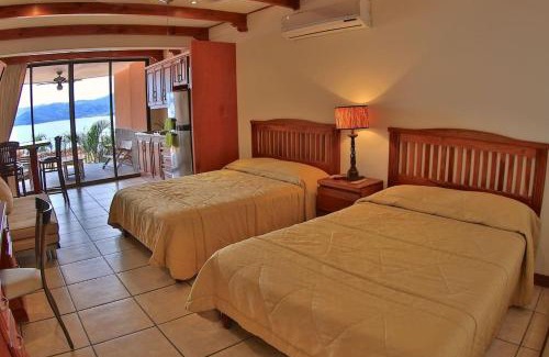 Playa Flamingo Apartment | Hotel room-style ocean-view unit in Flamingo with pool
