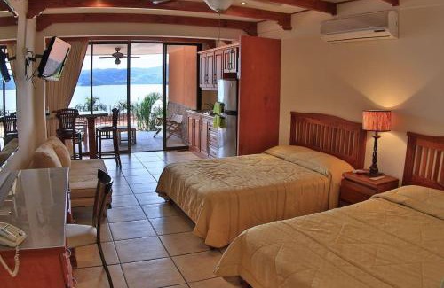 Playa Flamingo Apartment | Hotel room-style ocean-view unit in Flamingo with pool