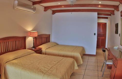 Playa Flamingo Apartment | Hotel room-style ocean-view unit in Flamingo with pool