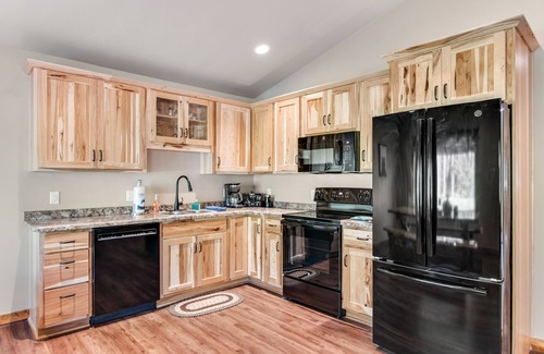 Conover House | Inviting dog-friendly cabin with hot tub, fireplace, patio, grill, central AC, & W/D