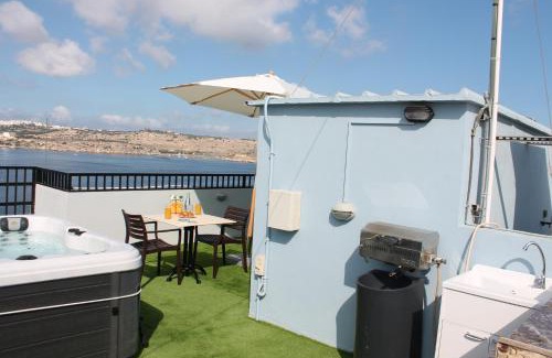 Bugibba Apartment | Islet Promenade Studio with Hot Tub and Panoramic Sea Views by GetawaysMalta