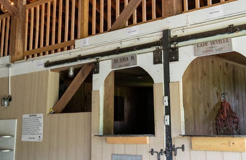 Paint Lick House | Kentucky Inn and Horse Farm. Stable Suite, with window looking into the Goat Stall