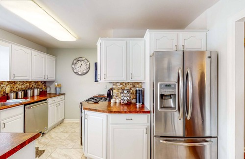 Portage House | Lake-view home with private hot tub, deck