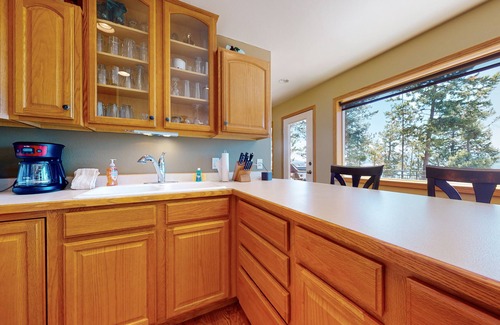 Woods Bay Cabin | Lakefront getaway with dock, 400- square-foot deck, close to town