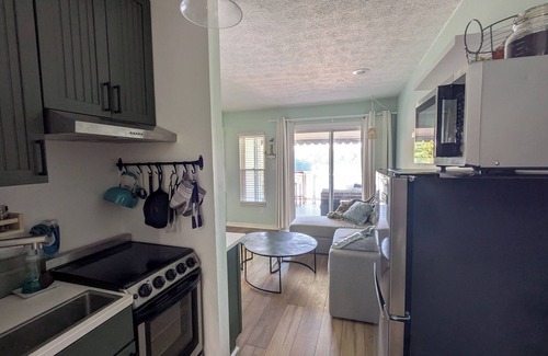North Shore Condo | Lakefront Hideaway - 2 Kayaks Included & Outdoor Balcony Perfect for Relaxing