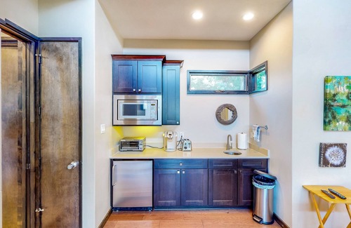 Spicewood Cabin | Lakeside cabin with outdoor kitchen/dining, firepit, WFH desk, soaking tub