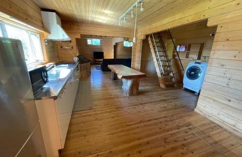 Toyoura Apartment | large log cabin 桜