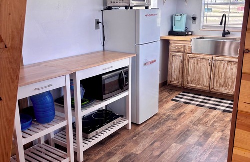 Duck Creek Village Cabin | Little Red Cabin with WiFi in Duck Creek Village