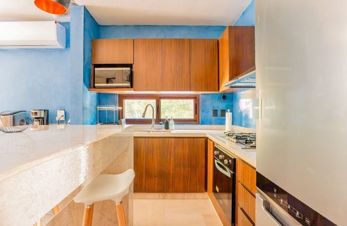 Xpu-Ha Apartment | Lower level apartment with high-speed internet pool, gym, & tennis courts