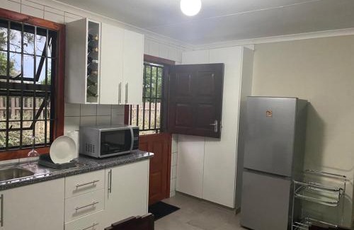 Greater Johannesburg Metropolitan Area Apartment | Man and Dog Log Cabin