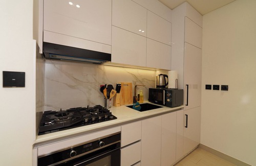 Jumeirah Village Circle Apartment | Modern Studio with Balcony Views of FIVE Hotels