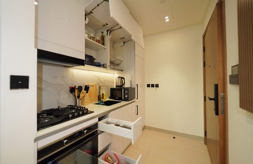 Jumeirah Village Circle Apartment | Modern Studio with Balcony Views of FIVE Hotels