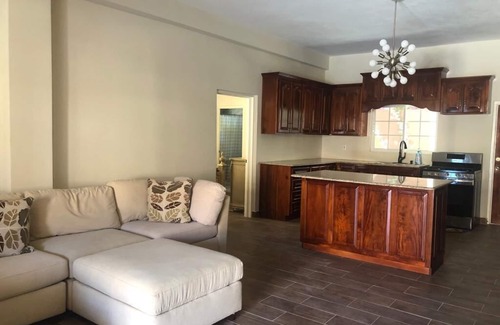 Runaway Bay Apartment | Mountain View Two Bedroom Apartment with En-Suite, Open Kitchen and Living Room