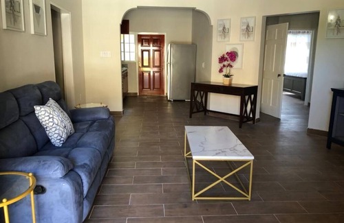 Runaway Bay Apartment | Mountain View Two Bedroom Apartment with En-Suite, Open Kitchen and Living Room
