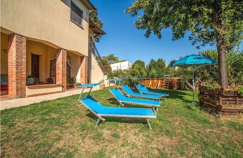 Magliano in Toscana House | Move into a functional holiday apartment with a garden and communal pool.