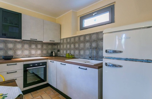 Castagneto Carducci Villa | Nice apartment in villa for 5 guests with pool, WIFI, A/C, patio and pets allowed