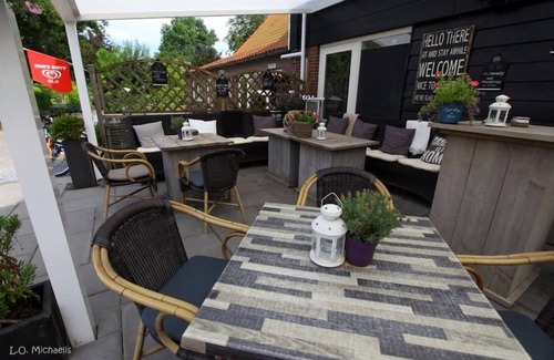 Stavenisse House | Oasis of relaxation - Het Puppenhuisje with communal pool,