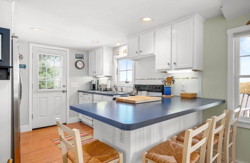 Sagamore Beach House | Oceanfront at Sagamore Beach with clean, crisp, Cape Cod interior and coastal furnishings