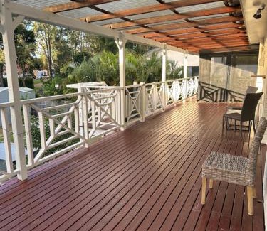 Gold Coast House | One bedroom with shared bathroom ground level of a two-story house