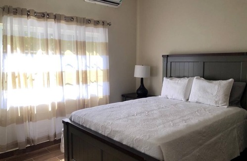 Runaway Bay Bed & Breakfast | Pavillion View Two Bedroom Apartment with En-Suite, Kitchen and Living Room