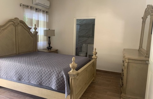 Runaway Bay Bed & Breakfast | Pavillion View Two Bedroom Apartment with En-Suite, Kitchen and Living Room