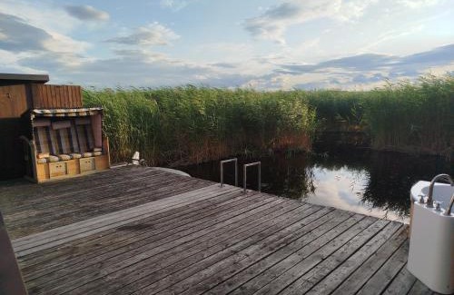 Rust House | Pfahlbau Sunset I Toplage Elektroboot inklusive