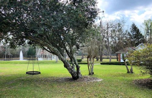 Midway House | Quaint Cottage with Covered Dock on the Pond and Walking Trails in Georgia