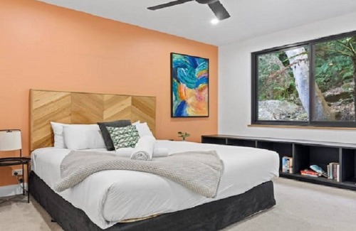 Horsfield Bay House | Relax with bush & water views