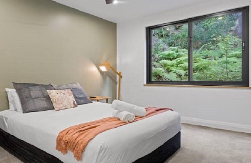 Horsfield Bay House | Relax with bush & water views