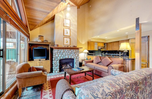 Village North House | Relaxing first-floor townhouse with a private hot tub, fireplace, & great views