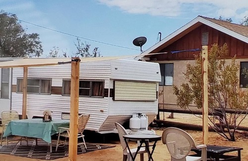 Joshua Tree RV Rental | Retro trailer in fun desert setting with private fire pit