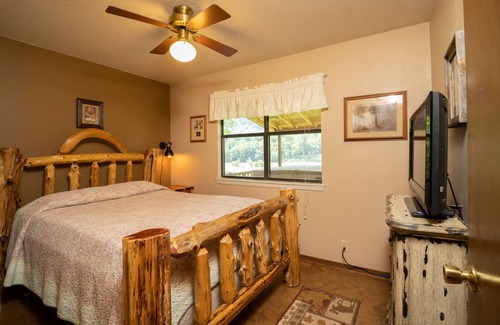 Boswell Cabin | Riverfront Cabin with Bluff Views Covered Deck and Hot Tub