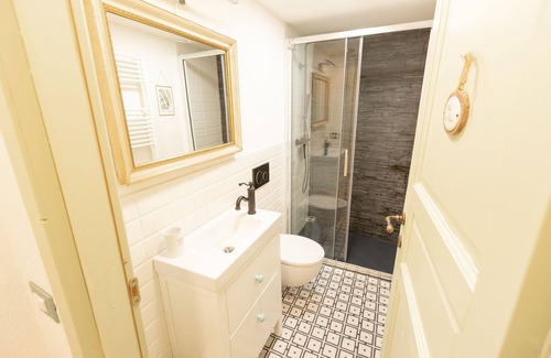 Trarego Viggiona House | Romantic and cuddly double room with fireplace-library and giant shower.