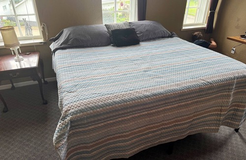 Spillville Apartment | Room 2: Sleep Where Prohibition Secrets Were Made - Historic Escape!
