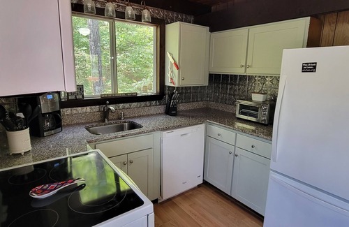 Eidelweiss Village Ski Chalet | Rustic Chalet pet friendly and close to all NH has to offer.