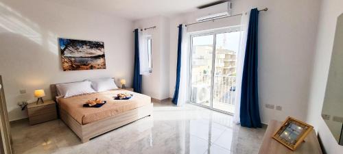 Għadira Apartment | Seaside Serenity 8 - few mins walk to the beach by QuickTrips