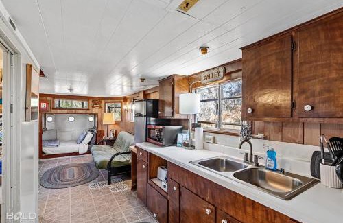 Uncertain House | Shipwreck With Upper Deck & Kayaks & Canoes