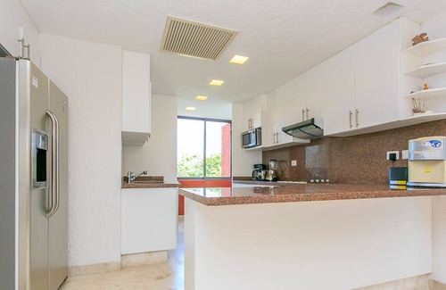 Playacar Fase II Condo | Sian Kaan by Stella Rentals