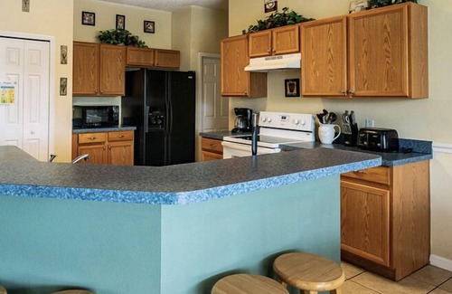 Crescent Lakes Villa | Sprawling Private Pool Home near Disney w/Pond Views & Game Room