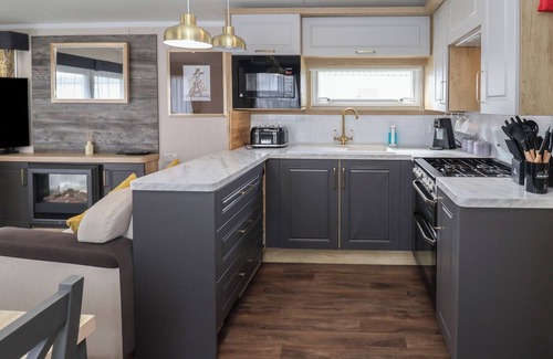 Hopton Cottage | STAG LODGE, CARAVAN 70, with pool in Belton, Norfolk