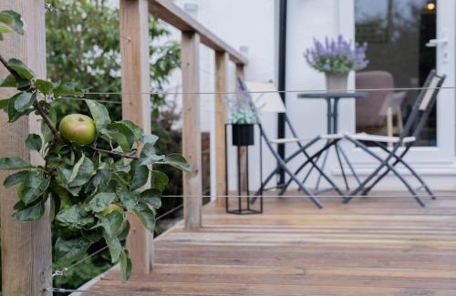 Llangollen House | Stylish and spacious four-bedroom cottage by the river Eco-friendly hot tub, cozy open fireplace Beautiful view