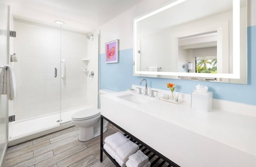 New Town Hotel | Sun, Sip, & Socialize | Island Stay with 2 Pools & Lawn Games