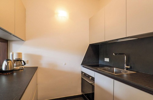 Susello Apartment | Tastefully furnished 3½-room maisonette apartment with balcony and roof terrace in a residence with pool