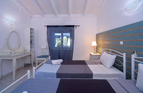 Longos House | This recently renovated beach house is located just a few steps behind Levrecchio beach and is surro