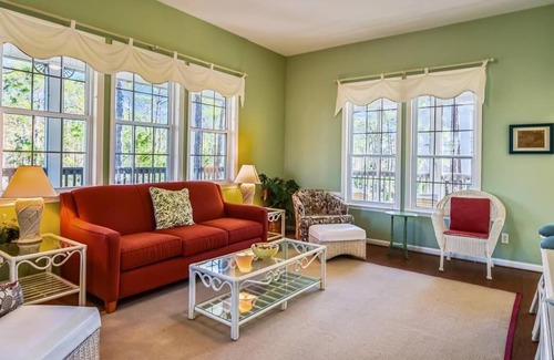 Plantation House | This sweet cottage is fenced by lush, natural landscaping and offers a peek of the Apalachicola Bay.