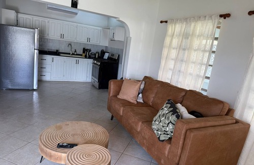 Fitches Creek House | Tropical Bliss Retreat – 3BR Oasis near Beach, St. John’s & Airport