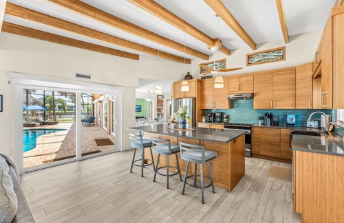 Cocoa Beach House | Tropical Riverfront Retreat w/Heated Pool, Spa, Tiki Hut & Dock! 🌴