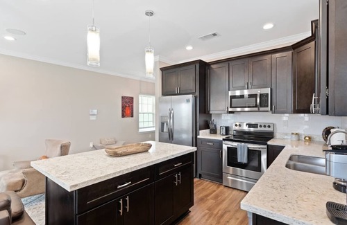 Tulane - Gravier Apartment | Urban Mid-City Getaway: Exclusive 4BR, 3BA, Balcony, Gated Pool, Parking