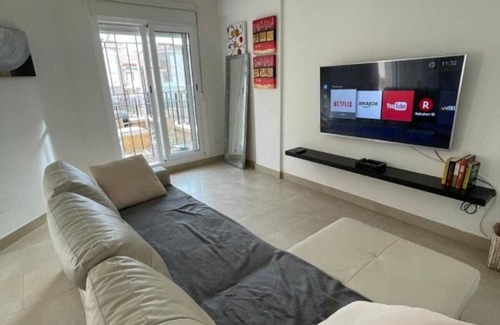 Santa Pola Villa | Villa 'Adosado Santa Pola' with Shared Pool, Wi-Fi and Air Conditioning